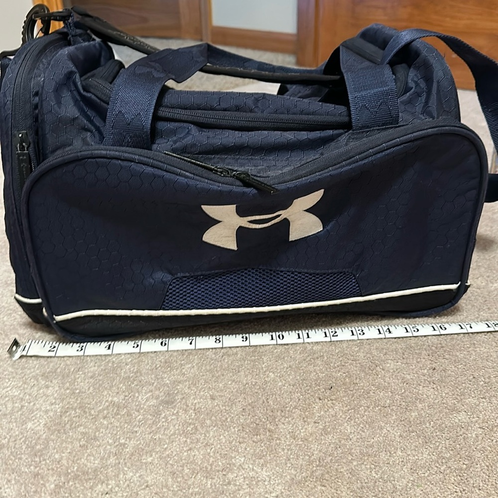 Under Armour navy blue duffle bag, 17 inches.